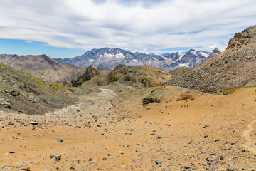 Excursion to the Gran Paradiso in the Alps. Search for rocks, minerals and precious stones. Study of the surface of rocks with sedimented debris over time. Lunar landscape, Martian landscape.
