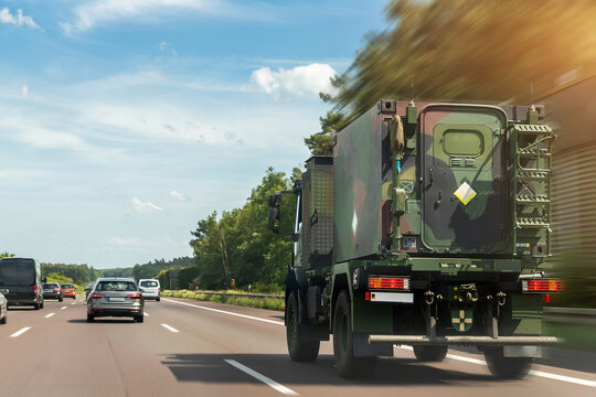 German Armoured Semi-trailer Cargo Truck Carrier Drives Military Convoy Highway Road. ALLIANCE Troops Moving Reloceation Rapid Reaction Force Reinforcement Eastern Europe. Sweden Finland Fortification