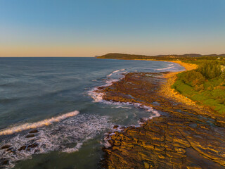 Aerial sunrise seascape with  clear skies