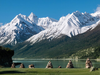 Scenic beauty of snow-capped mountains and mani stones piles
