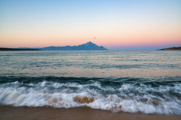 Wave in the sea, landscape with Mount Athos in the background in Greece