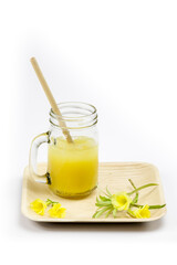 Bamboo straw in an orange juice glass