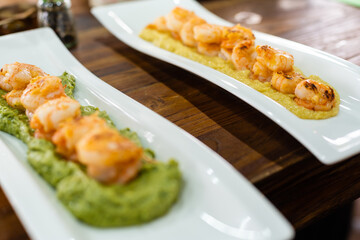 Prawns with garlic. Popular dish of Spanish cuisine. The ingredients are peeled prawns, garlic and olive oil. Served in clay pot They must be eaten quickly, without getting them to cool down.