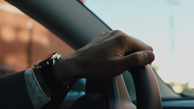 A successful businessman, banker, financier broker drives premium car work office, make deal client. Status, successful life rich person. Driving around metropolis. Personal driver leader premium taxi