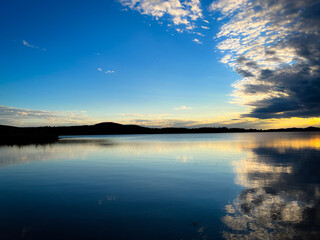 Fantastic sky reflection on the lake surface, north lake, fantastic cloudy sky, twilight 