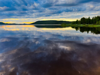 Fantastic sky reflection on the lake surface, north lake, fantastic cloudy sky, twilight 