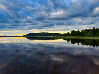 Fantastic sky reflection on the lake surface, north lake, fantastic cloudy sky, twilight 