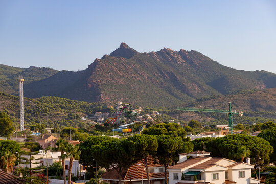 Mountains. Desert of Las Palmas seen from the town of Benicasim, in Castellón. Mountainous and rocky system with green trees throughout the rocky extension, in Spain. Europe. Horizontal photography.