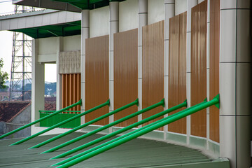 Steel poles lined up to hold the terrace of the building