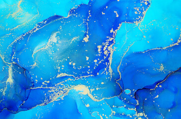 Abstract colorful background, wallpaper. Bright alcoholic ink, mixing of acrylic paints. Modern art, painting, a mixture of blue colors, glowing golden streaks