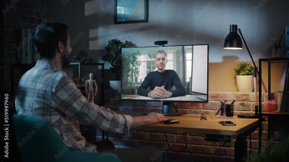 Poster creative specialist chatting on video call with a handsome colleague sitting in office meeting room.
