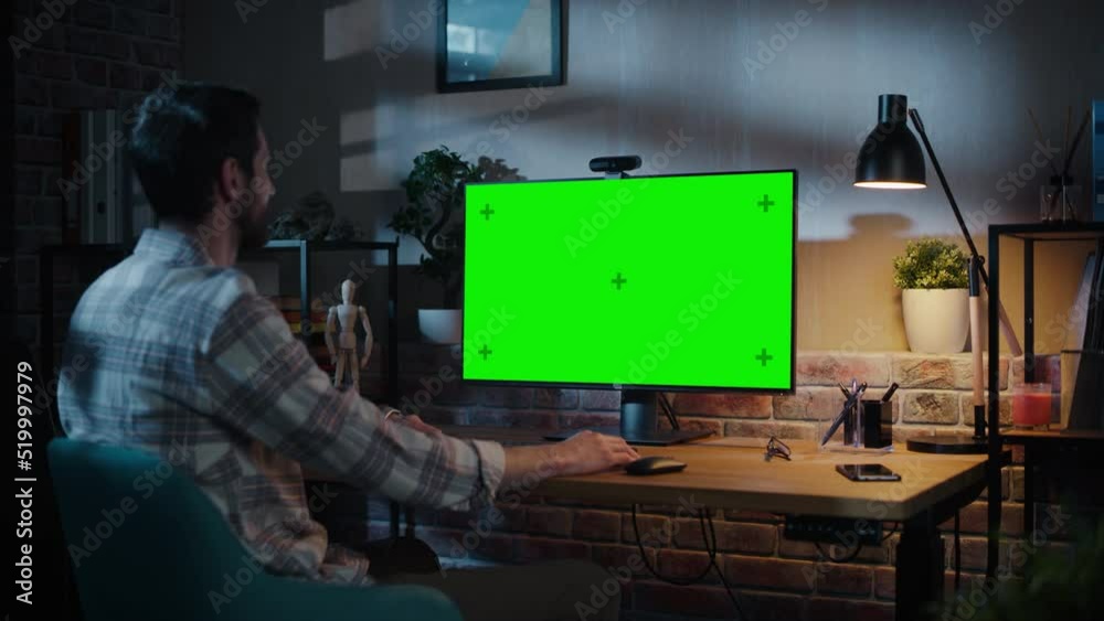Poster Creative Specialist Chatting on Video Call on Desktop Computer with Monitor with Green Screen Mock Up at Home Living Room. Freelancer Calling Colleagues Over Internet on Social Network Conference App.