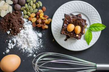 Delicious chocolate brownie homemade, ingredients of brownie,closeup fudge brownie,homemade bakery and dessert,Pieces of fresh brownie,confectionery concept.