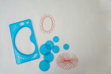 Blue Spiral Design Templates with Two Red Spiral Designs on White Paper