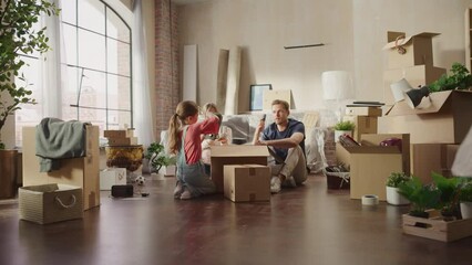 Happy Homeowners Moving In: Lovely Couple Sitting on the Floor of Cozy Apartment Unpacking Cardboard Boxes, Little Daughter Joins them. Cheerful Day, Happiness, Sweet Home for Young Family Having Fun - Powered by Adobe
