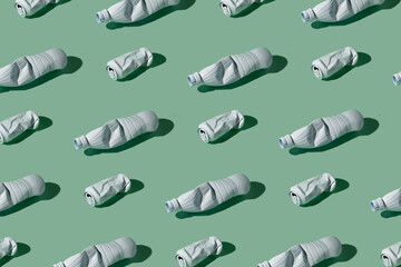 Used aluminium can and plastic bottle pattern.  Ecology, recycling and pollution problem concept. Mint green background.
