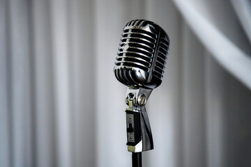 Retro microphone on curtain stage background