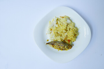 Indonesian traditional food, yellow spiced fish peda on a white background