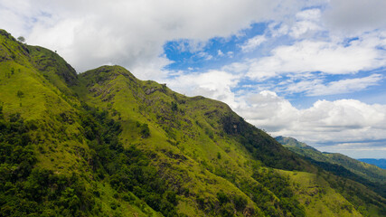 Aerial view of Tropical mountain range and mountain slopes with rainforest. Ella Rock, Sri Lanka.