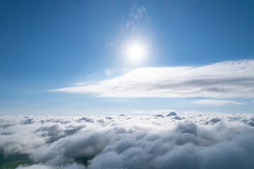 Obraz premium Flying over beautiful fluffy clouds