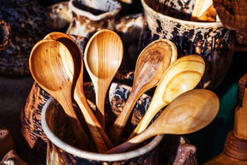 Wooden spoons in retro style. Manufacture and sale of handmade cutlery. Close-up