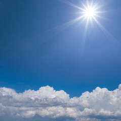 Naklejka na ściany i meble sparkle sun on cloudy sky, beautiful natural background