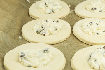 Dough rolled out on the table in the form of cakes