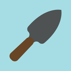 small garden shovel on a blue background
