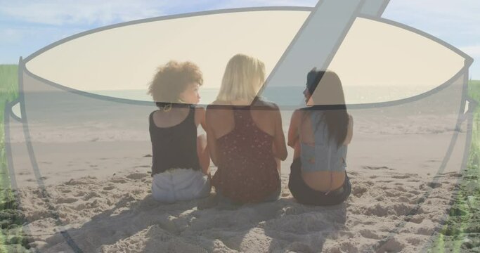 Animation of coffee cup against rear view of diverse three women sitting together at the beach