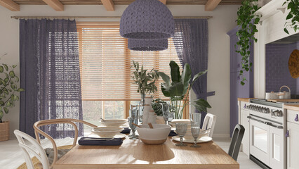 Wooden country dining table setting in white and purple tones. Kitchen, pendant lamps and window. Scandinavian boho interior design