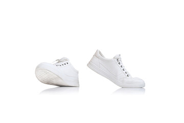Casual, trendy white gumshoes, sneakers isolated over white studio background