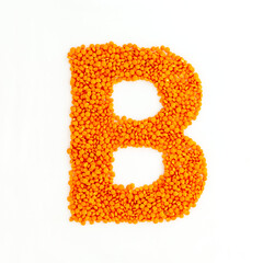 Capital letter B made from red lentils. Lentil font. White background. Bright font for menu or food blog. Lettering design element. Init cap