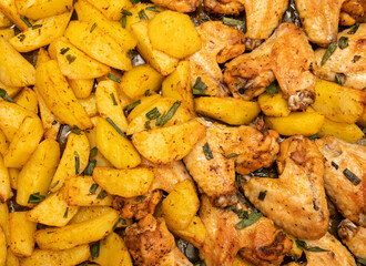Baked chicken wings with potatoes