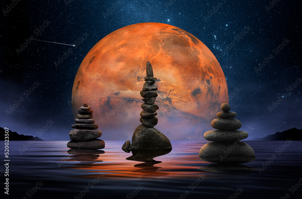 Wall mural stones in zen balance on a lake and the planet mars as a background