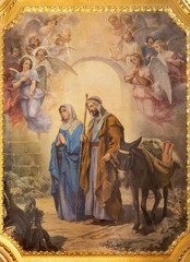 VALENCIA, SPAIN - FEBRUAR 17, 2022: The painting of Flight to Egypt in the church Basilica Sagrado Corazon from year 1897.