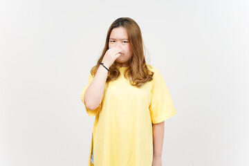 Smelling something stinky and disgusting of Beautiful Asian Woman wearing yellow T-Shirt
