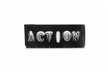 Black color banner that have embossed letter with word action on white paper background