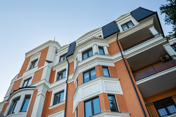 Obraz premium Crop of building facade with windows and roof