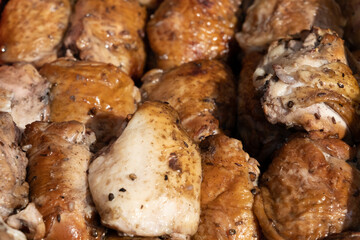 Slow smoked chicken legs juicy and tasty. Rural market.