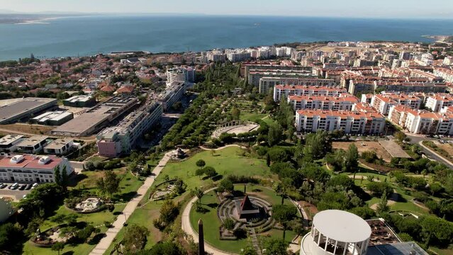 Lisbon, Portugal - July 29, 2022: Aerial drone view of Parque dos Poetas in Oerias, translated to Poet's Park in Lisbon, Portugal