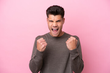 Young caucasian man isolated on pink background frustrated by a bad situation