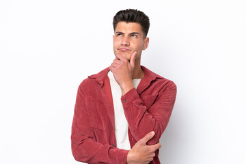 Young caucasian man isolated on white background having doubts and thinking