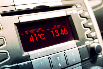 Summer hot temperatures. High temperature on car dashboard display