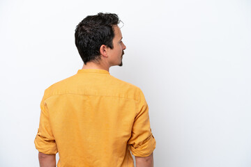 Young man with moustache isolated on white background in back position and looking side