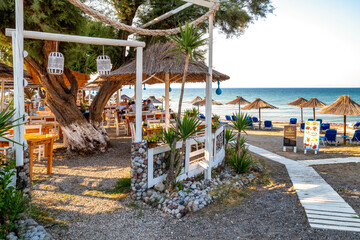 Taverna and sandy beach on west coast of Rhodes island in Greece