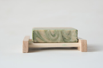 Homemade natural soap bar on black background 