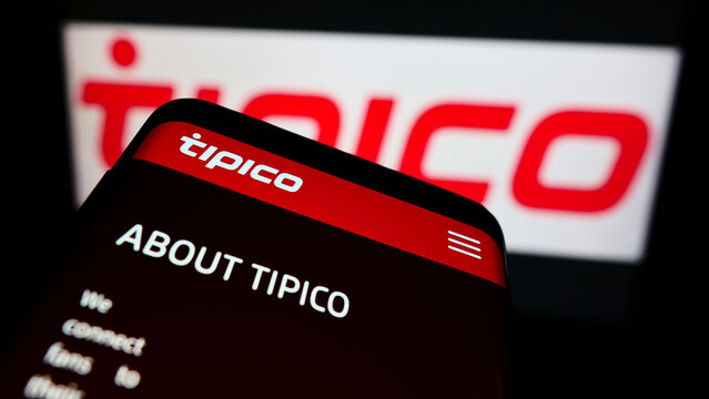 Stuttgart, Germany - 01-08-2022: Mobile phone with webpage of sports betting company Tipico Co. Ltd on screen in front of business logo. Focus on top-left of phone display.