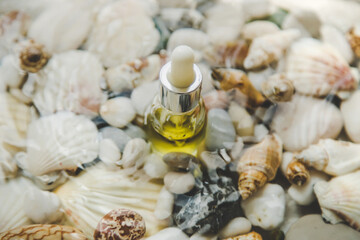 Bottle with cosmetics on the seabed. Selective focus.