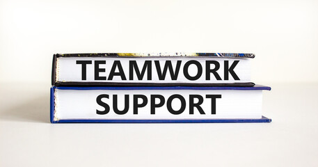 Teamwork support symbol. Concept words Teamwork support on books on a beautiful white table white background. Business and teamwork support concept. Copy space.