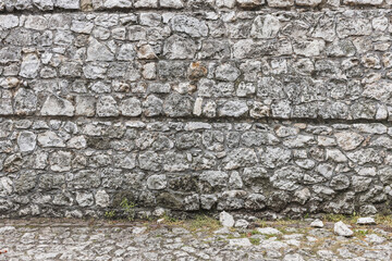 ściana z kamienia w średniowiecznym klimacie  o bezowej kolorystyce.